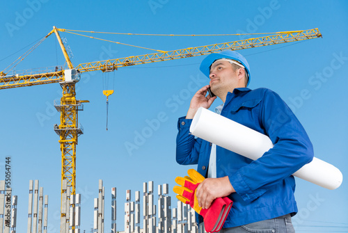 Photo: Foreman with blueprints Foreman with blueprints