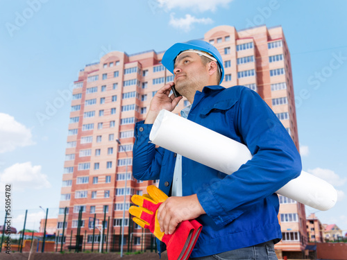 Photo: Foreman with blueprints Foreman with blueprints