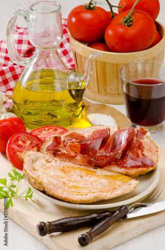 Photo: Spanish Cuisine. Tomato bread and Serrano Ham. Pa amb tomaquet i Spanish Cuisine. Tomato bread and Serrano Ham. Pa amb tomaquet i