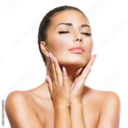 Photo: Beauty Portrait. Beautiful Spa Woman Touching her Face Beauty Portrait. Beautiful Spa Woman Touching her Face