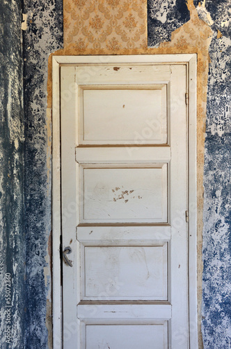 Photo: shut door in abandoned house shut door in abandoned house