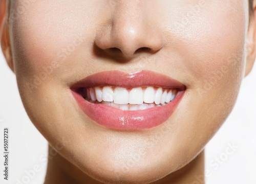 Photo: Healthy Smile. Teeth Whitening. Smiling Young Woman Healthy Smile. Teeth Whitening. Smiling Young Woman