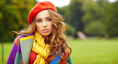 Photo: Fashion woman walking in autumn park Fashion woman walking in autumn park