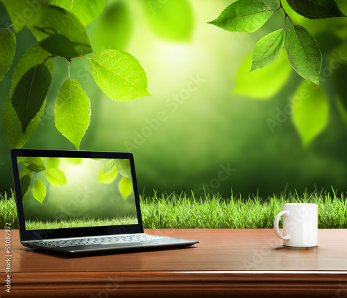 Photo: summer background with wooden table and notebook summer background with wooden table and notebook