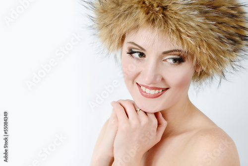 Photo: young woman wearing fur har young woman wearing fur har
