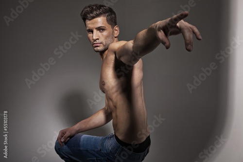 Photo: Handsome male model with trendy haircut Handsome male model with trendy haircut