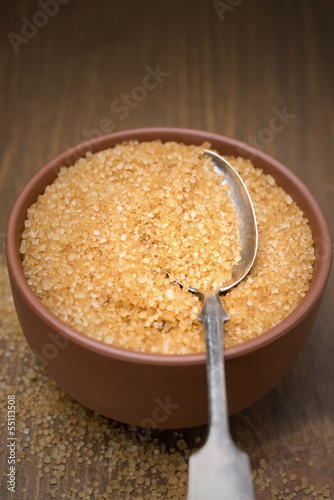 Photo: brown sugar in a bowl and spoon, selective focus brown sugar in a bowl and spoon, selective focus