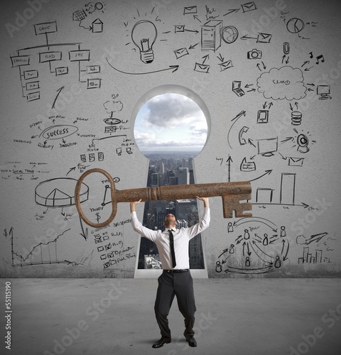 Photo: Businessman with the key to success Businessman with the key to success