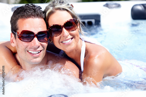 Photo: Happy couple in hot tub Happy couple in hot tub