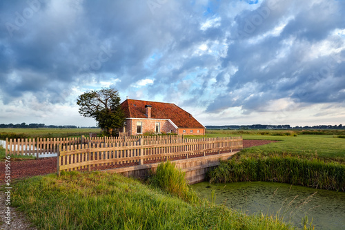 Photo: charming farmhouse and blue sky charming farmhouse and blue sky