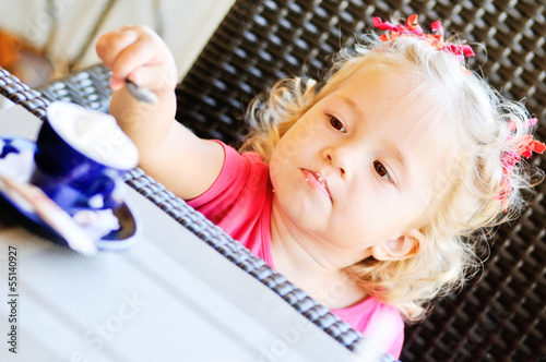 Photo: toddler girl in cafe toddler girl in cafe