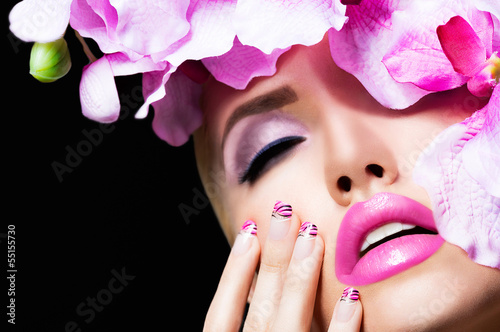 Photo: Beautiful blonde girl with flowers and perfect makeup Beautiful blonde girl with flowers and perfect makeup