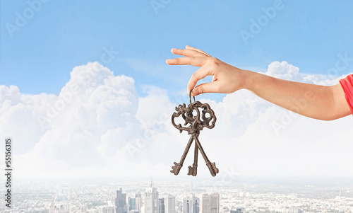 Photo: Hand holding keys Hand holding keys