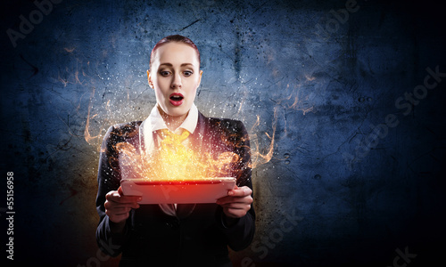 Photo: Young business woman with ipad Young business woman with ipad