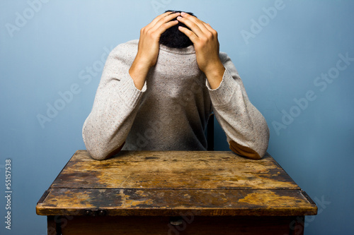 Photo: Young man hiding in his jumper Young man hiding in his jumper
