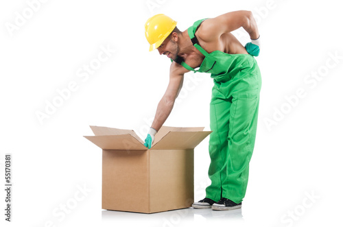 Photo: Man in green coveralls with boxes Man in green coveralls with boxes
