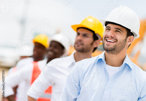Photo: Group of men at a construction site Group of men at a construction site
