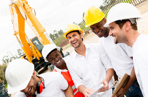 Photo: Group of workers at a building site Group of workers at a building site