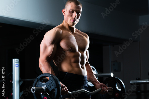 Photo: Dumbbell training in gym Dumbbell training in gym