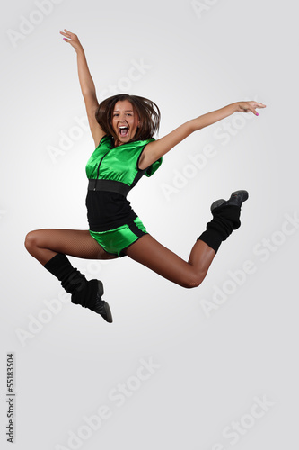 Photo: Young female dancer against white background Young female dancer against white background