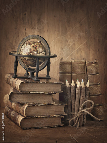 Photo: Stack of books and globe Stack of books and globe