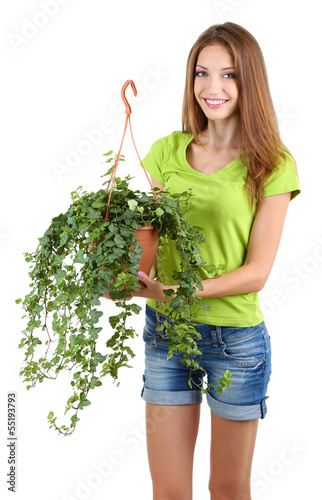 Photo: Beautiful girl with flower in pot isolated on white Beautiful girl with flower in pot isolated on white