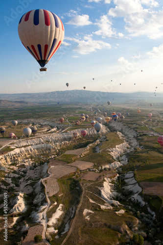 Photo: Hot air balloons rise over valley, Turkey Hot air balloons rise over valley, Turkey
