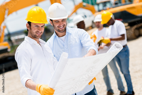 Photo: Architects at a building site Architects at a building site