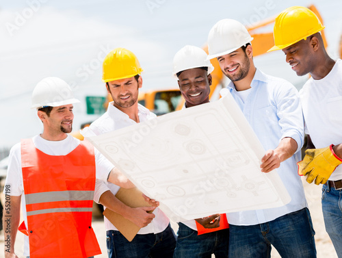 Photo: Group of workers at a construction Group of workers at a construction