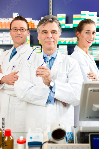 Photo: Team of pharmacists in pharmacy Team of pharmacists in pharmacy