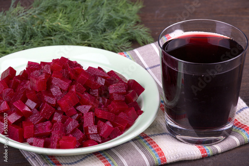 Photo: Fresh segments of a beet and beetroot juice Fresh segments of a beet and beetroot juice