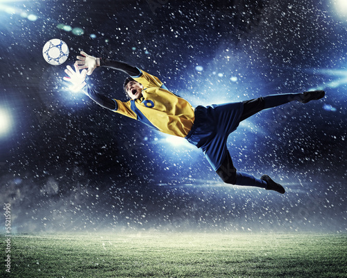 Photo: Goalkeeper catches the ball Goalkeeper catches the ball