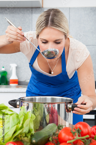 Photo: Young Woman Tasting Food Young Woman Tasting Food