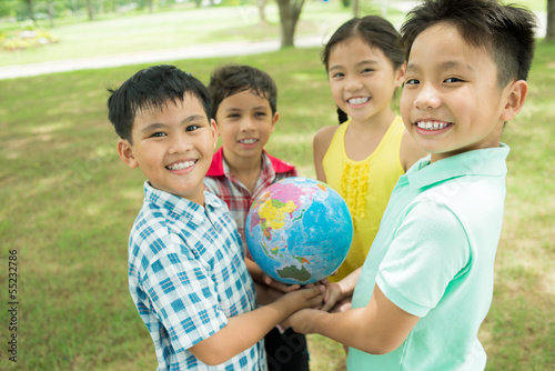 Photo: Kids with globe Kids with globe