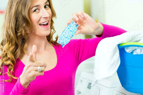 Photo: Female student in a laundry Female student in a laundry