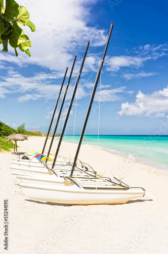 Photo: Sailing boats at the beautiful beach of Varadero in Cuba Sailing boats at the beautiful beach of Varadero in Cuba
