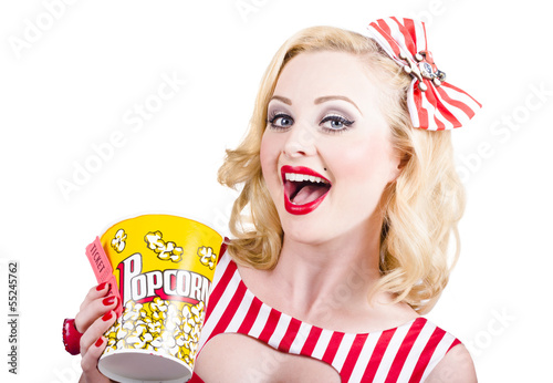 Photo: Retro girl taking popcorn to cinema Retro girl taking popcorn to cinema
