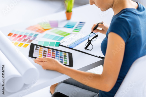 Photo: woman working with color samples for selection woman working with color samples for selection