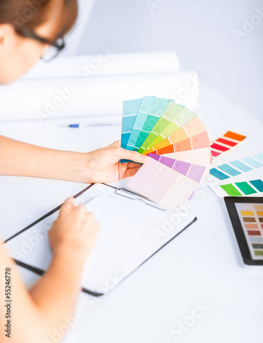 Photo: woman working with color samples for selection woman working with color samples for selection