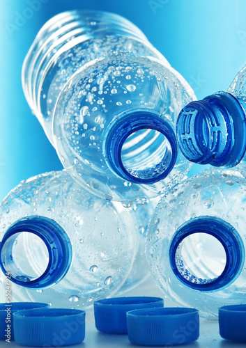 Photo: Composition with empty polycarbonate plastic bottles of mineral Composition with empty polycarbonate plastic bottles of mineral
