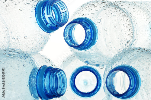 Photo: Composition with empty polycarbonate plastic bottles of mineral Composition with empty polycarbonate plastic bottles of mineral