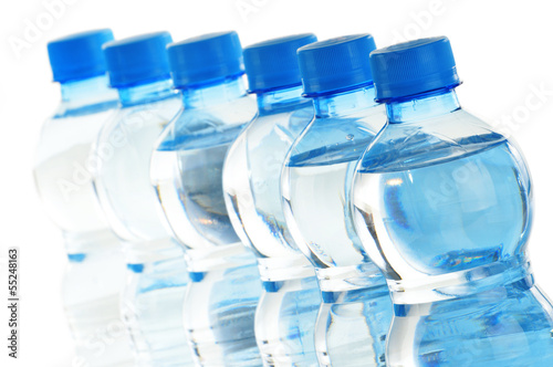 Photo: Composition with empty polycarbonate plastic bottles of mineral Composition with empty polycarbonate plastic bottles of mineral