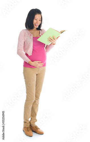 Photo: pregnant Asian woman reading book pregnant Asian woman reading book