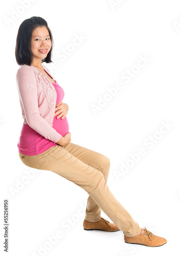 Photo: Pregnant Asian woman sitting Pregnant Asian woman sitting
