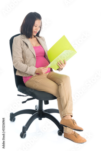 Photo: Working pregnant Asian business woman Working pregnant Asian business woman