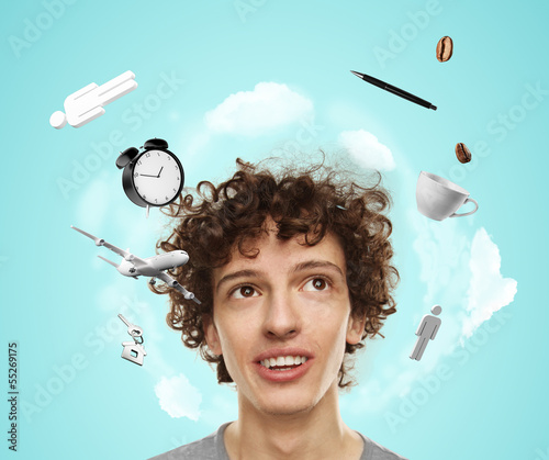 Photo: young boy thinking on travel on a blue background young boy thinking on travel on a blue background