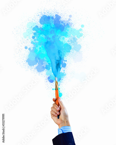 Photo: Human hand holding paint brush Human hand holding paint brush