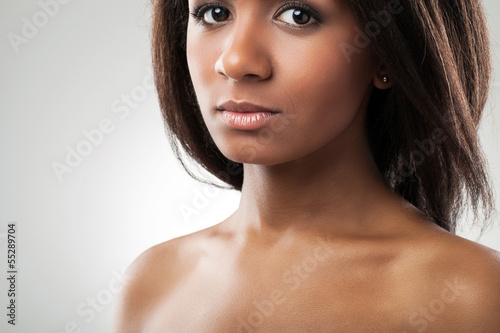 Photo: Beautiful woman with her shoulders naked closeup Beautiful woman with her shoulders naked closeup