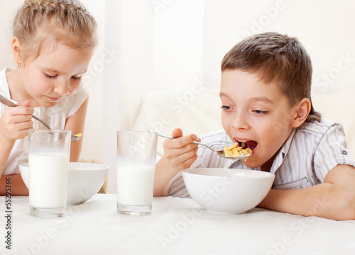 Photo: Children eat breakfast Children eat breakfast