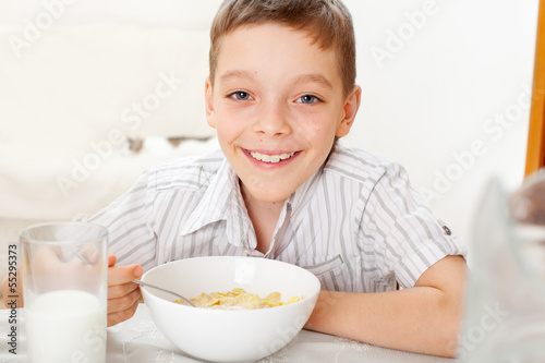 Photo: Boy eating frosted flakes Boy eating frosted flakes